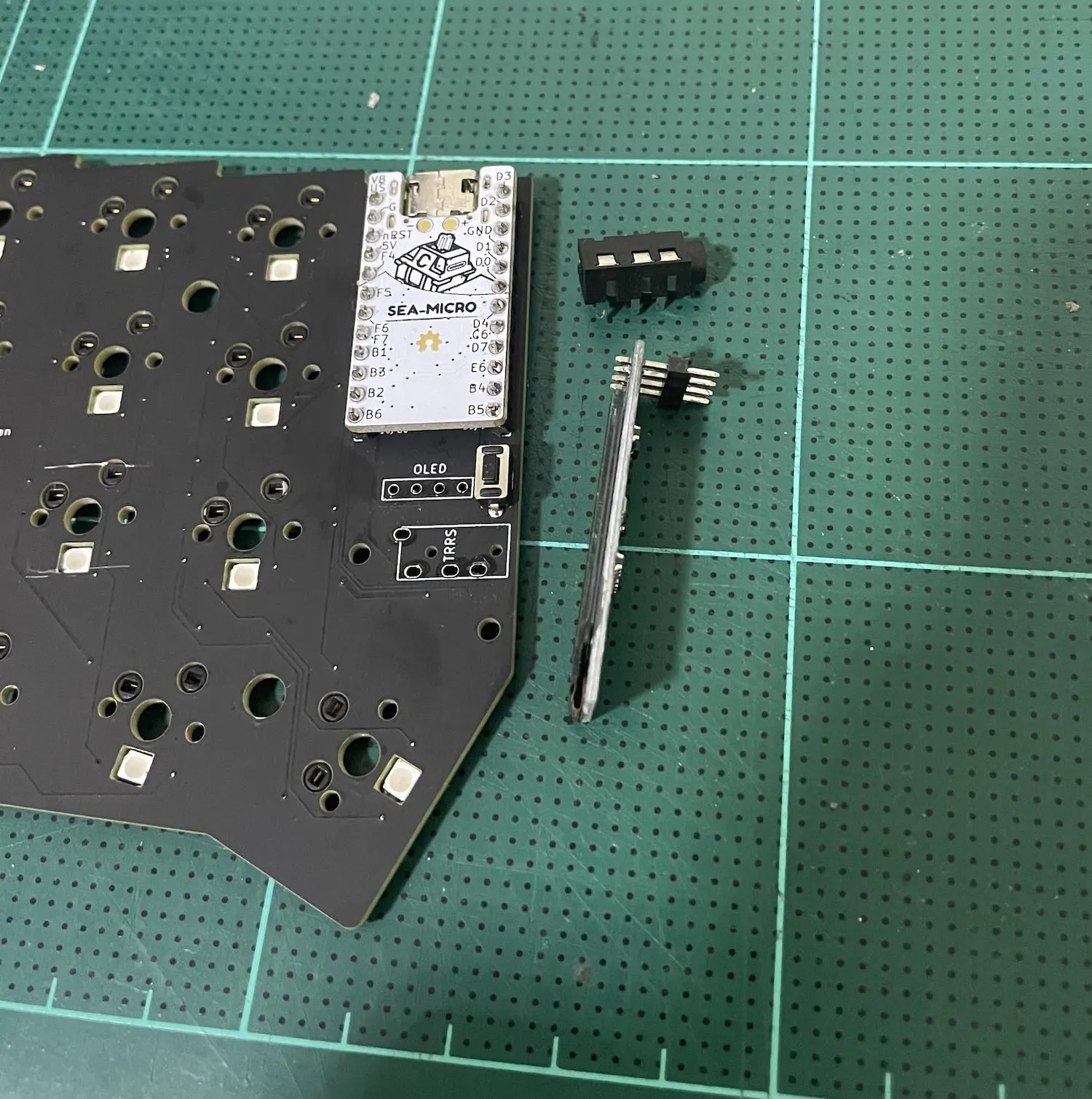 The OLED screen and TRRS Jack removed from the board